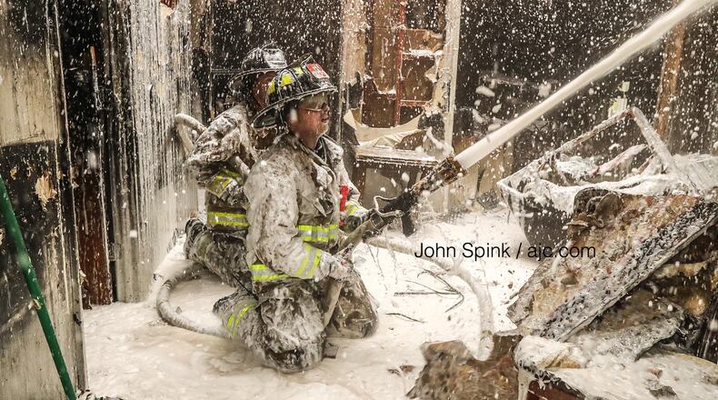 Atlanta firefighters used foam to treat hot spots following a blaze at a duplex in the 500 block of Hamilton E. Holmes Drive.