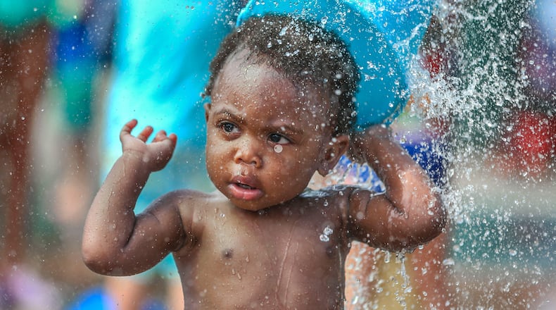 Michael Watts, 16 months, enjoys the Splashpad at Atlanta’s Historic Fourth Ward Park in June. It was the second-hottest summer in the history of Atlanta. The National Weather Service’s records go back to 1887. JOHN SPINK /JSPINK@AJC.COM