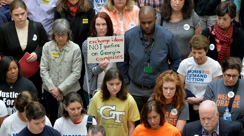 Groups opposed to campus-carry rally in the Capitol in March 2016 before delivering 30,000 petitions to Gov. Nathan Deal’s office urging the veto of the bill that eventually became law in Georgia. BRANT SANDERLIN/BSANDERLIN@AJC.COM