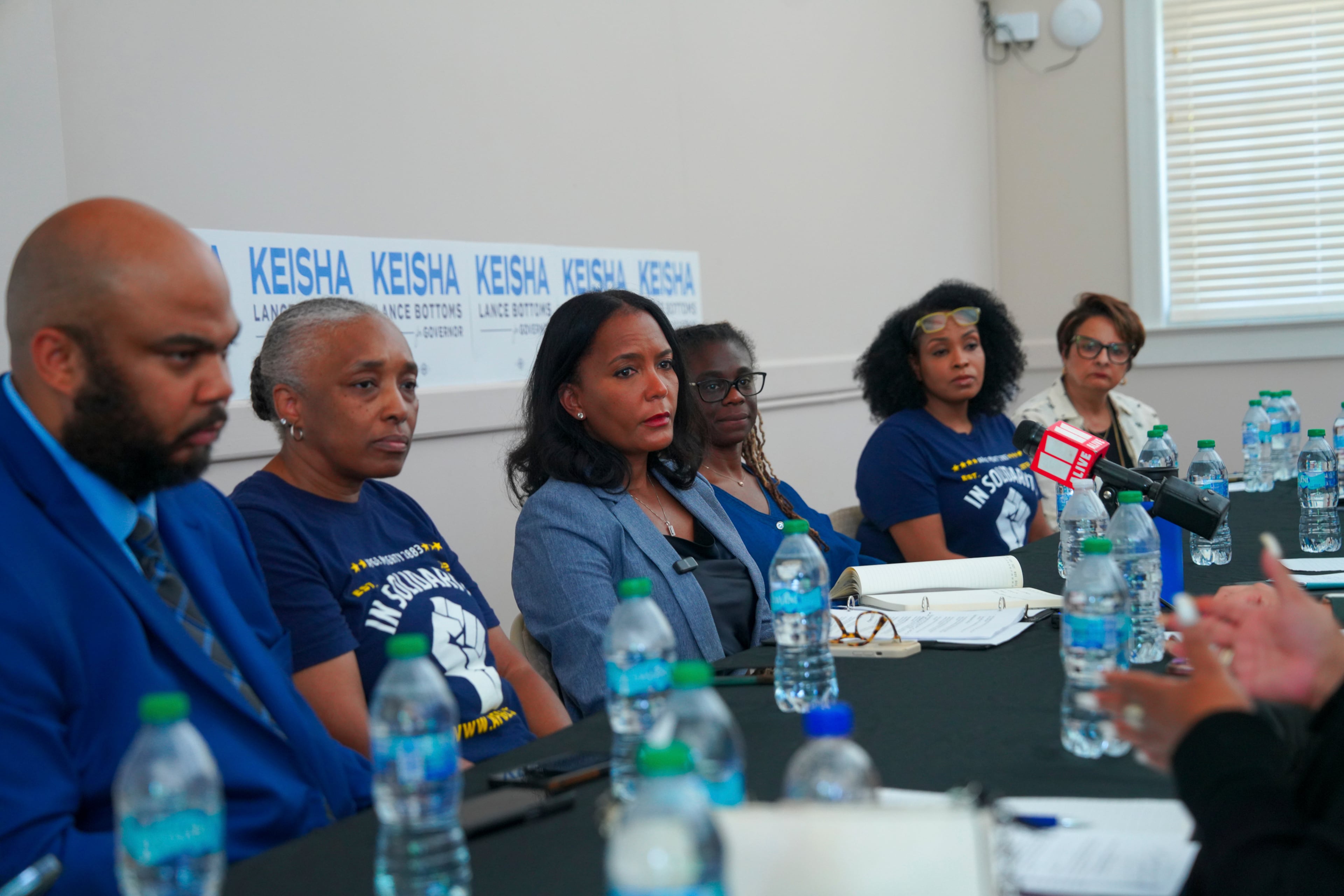 Democratic gubernatorial candidate Keisha Lance Bottoms (third from left) listened to laid off Centers for Disease Control and Prevention workers during a roundtable in Clarkston on Thursday.