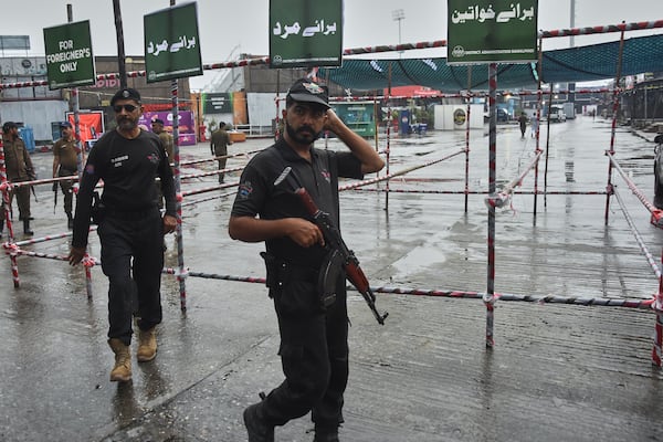 Police officers stand guard at an entry point to Pindi Cricket Stadium following a suspected Indian drones crashed in the parking area, in Rawalpindi, Pakistan, Thursday, May 8, 2025. (AP Photo/W.K. Youszai)