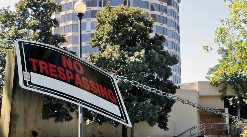 September 28, 2016 - Atlanta - The building formerly known as the Presidential Boutique Condotel lies vacant and in disrepair. Hefty fines loom for the owners of the rundown iconic Spaghetti Junction tower after they declined to resolve a series of code violations this week. A trial is set for Oct. 11 on the 34 code violations charged to the owners of the 15-story former hotel and condo building. The owners face as much as $34,000 in fines if found guilty of the violations at the structure, which has been vacant several years. BOB ANDRES /BANDRES@AJC.COM