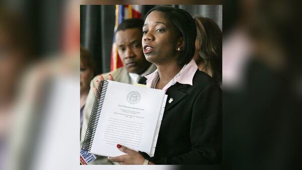 In this file photo from 2008, then-DA Gwendolyn Keyes speaks at a press conference. (AJC file photo)