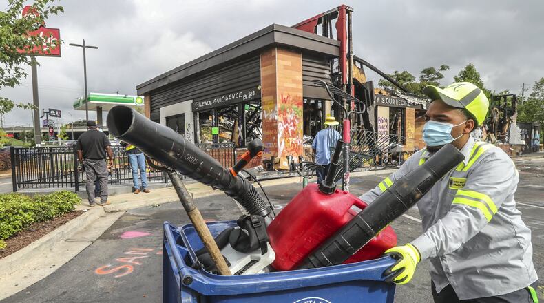 Atlanta police and sanitation crews finished removing protesters and their belongings Monday from the site of a restaurant where Rayshard Brooks was shot and killed by an officer last month. Monday’s cleanup followed a violent holiday weekend that saw 8-year-old Secoriea Turner fatally shot while sitting in a car near the restaurant. JOHN SPINK/JSPINK@AJC.COM