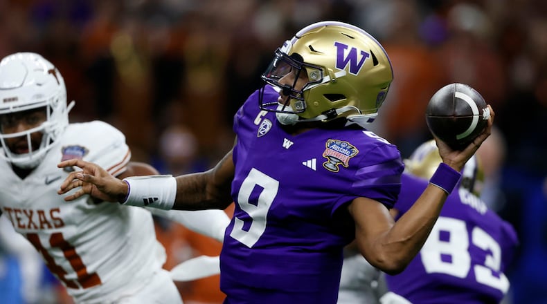 Washington quarterback Michael Penix Jr. throws a pass during the first half of an NCAA college football game Monday, Jan. 1, 2024, in New Orleans. (AP Photo/Butch Dill)