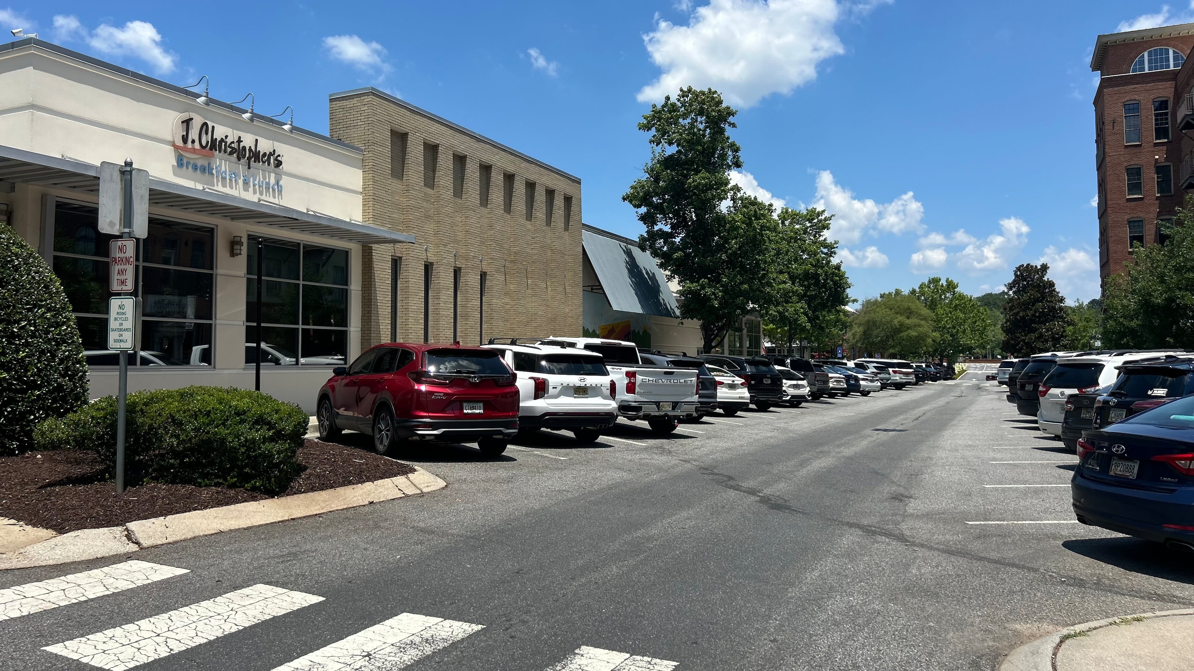 This parking area on Chambers Street near Hubbard Road in Woodstock will be among the downtown areas that will require visitors to pay $2 per two hours to park starting Monday. The first hour is free. (Gray Mollenkamp/AJC)