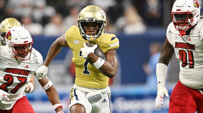 Chase Lane scores on a 48-yard touchdown catch against Louisville in the 2023 season opener.