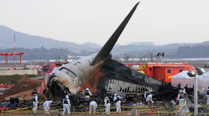 FILE - Rescue team members work at the site of a plane crash at Muan International Airport in Muan, South Korea on Dec. 31, 2024. (AP Photo/Ahn Young-joon, File)