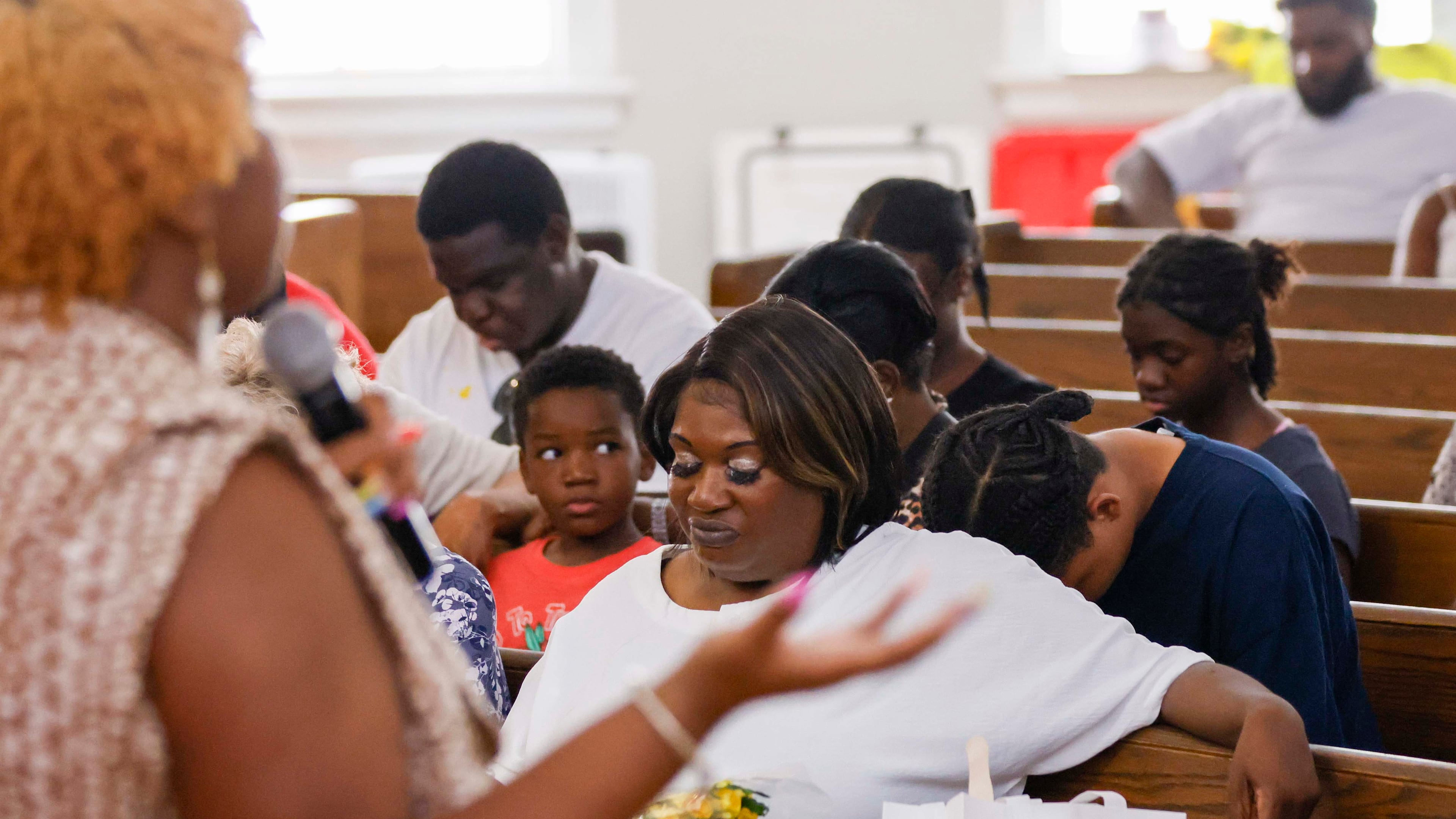 April Newkirk bows her head as she prays during a vigil in honor of Adriana Smith at the Park Avenue Baptist Church on Sunday, June 15, 2025. Adriana was declared brain dead while she was pregnant, but the state’s abortion law prevented doctors from removing her from life support. (Miguel Martinez/AJC)