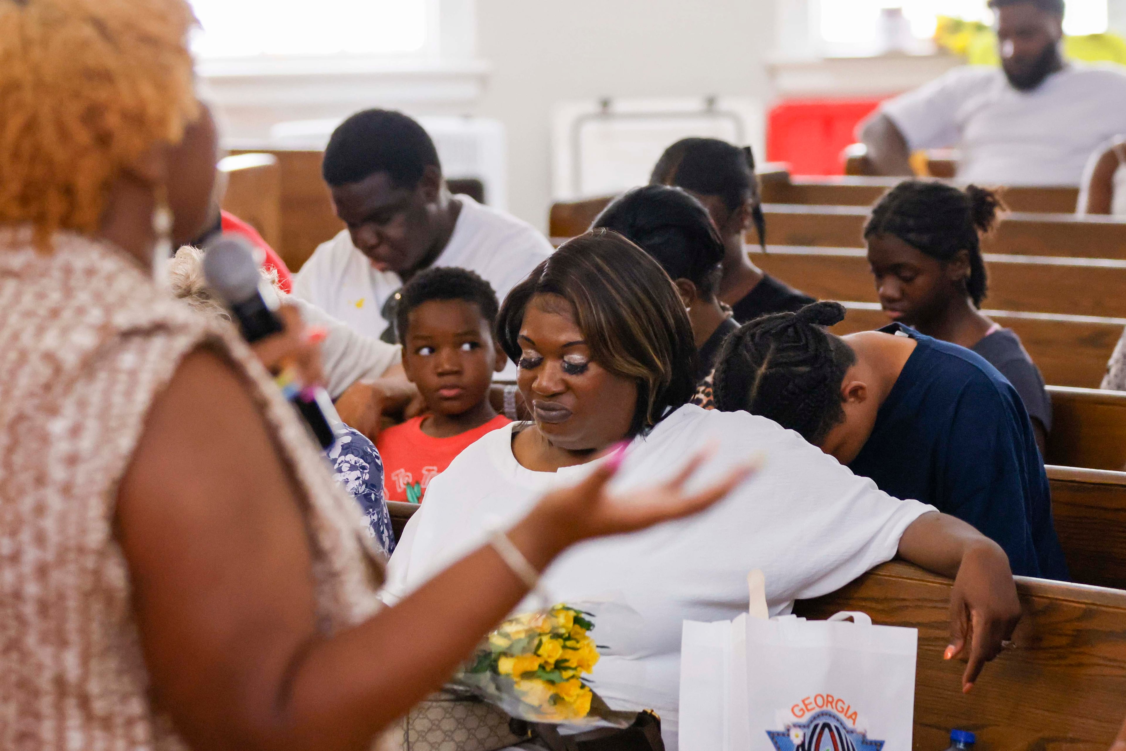 April Newkirk bows her head as she prays during a vigil in honor of Adriana Smith at the Park Avenue Baptist Church on Sunday, June 15, 2025. Adriana was declared brain dead while she was pregnant, but the state’s abortion law prevented doctors from removing her from life support. (Miguel Martinez/AJC)