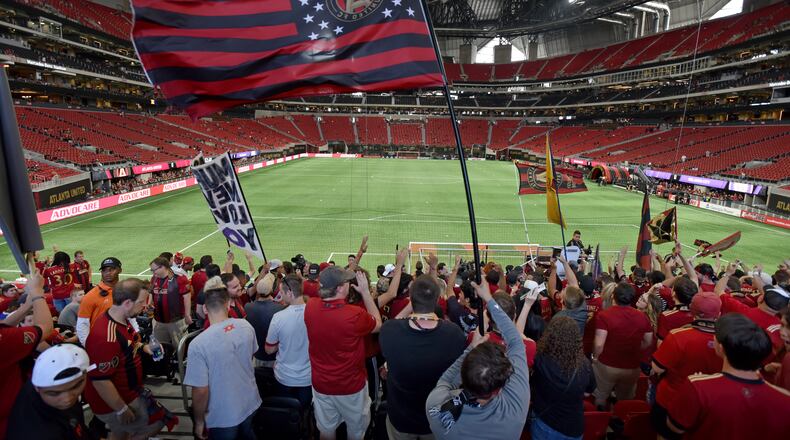 September 16, 2017 Atlanta - Atlanta United fans cheer before an MLS soccer match at Mercedes-Benz Stadium on Saturday, September 16, 2017. Saturdayâs Atlanta United match against Orlando City will be the third at Mercedes-Benz for the first-year franchise, and a new Major League Soccer single-game attendance record is expected to be set in the latest meeting of the southern MLS rivals. HYOSUB SHIN / HSHIN@AJC.COM