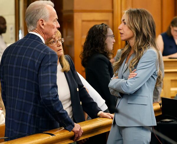 Kare Read, right talks with her parents William and Janet Read during a break in the court proceedings at Norfolk Superior Court in Dedham, Mass., Tuesday June 3, 2025. (Greg Derr/The Patriot Ledger via AP, Pool)