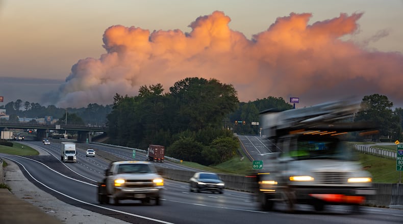 A large plume sits in the sky above Conyers on Monday Sept. 30, 2024 as I-20 reopened following the evacuation of about 17,000 people. Several metro Atlanta counties reported a haze and chemical smell Monday morning. A shelter-in-place order for all of Rockdale County has been extended indefinitely Monday. (John Spink/AJC)