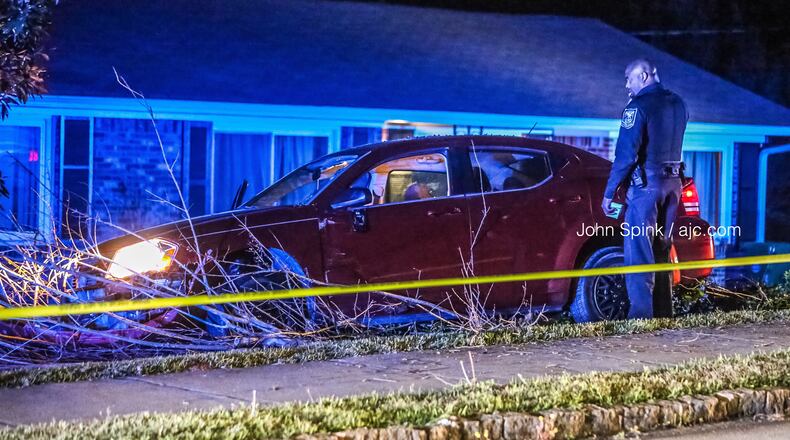 Officers shut down a section of Glenwood Road near Atherton Drive early Tuesday in connection with the shooting after a car ran off the road.