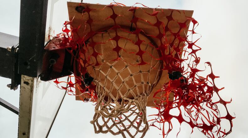Slammed Shut: the basketball goal at Decatur’s Winnona Park Elementary where, for an indeterminate period, no dunks nor long range jumpers will grace this net. Bill Banks for the AJC