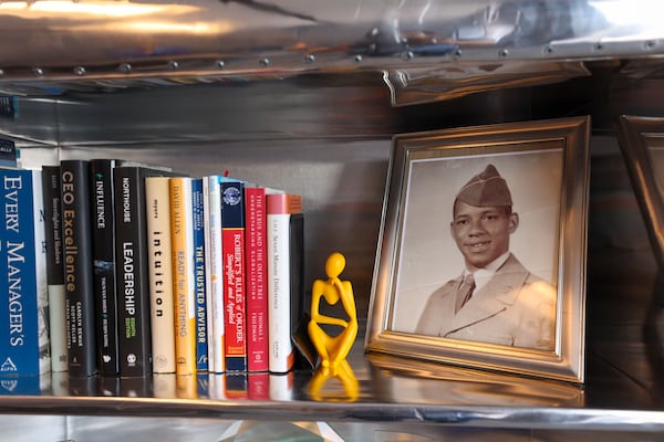 A photo of Joy Rohadfox’s father, Ronald Rohadfox, appears at her office in Atlanta on April 15, 2026. Ronald, the company's founder, diedi n 2014. (Arvin Temkar/AJC)