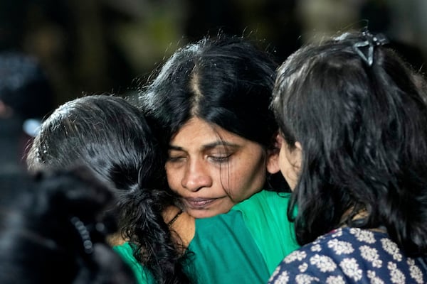 The wife of Sanjay Lele, who died in an attack on tourists in the Pahalgam region of Indian-administered Kashmir, reacts at Dombivali near Mumbai, India, Wednesday, April. 23, 2025.(AP Photo/Rajanish Kakade)