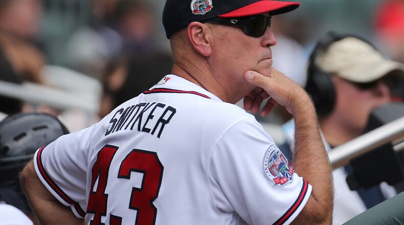 Brian Snitker strikes the manager's pose during an early-season Braves game in 2017. (Curtis Compton/ccompton@ajc.com)