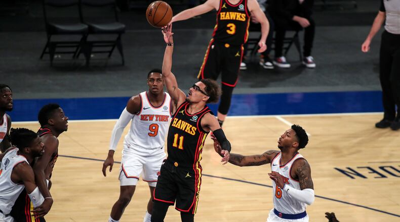 Atlanta Hawks guard Trae Young (11) shoots against the New York Knicks during the first quarter of an NBA basketball game Wednesday, April 21, 2021, in New York. (Wendell Cruz/Pool Photo via AP)