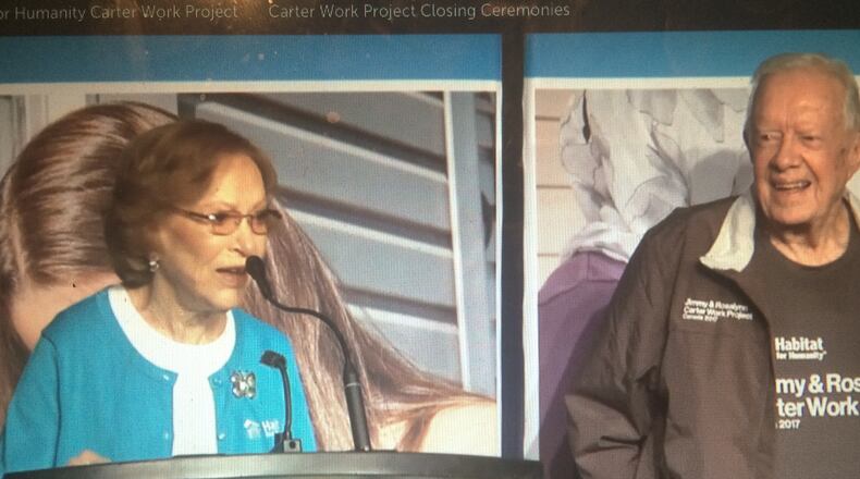 Jimmy Carter smiles as his wife addresses the closing ceremony audience for the 34th Habitat for Humanity Jimmy & Rosalynn Carter Work Project in Winnipeg Friday night.