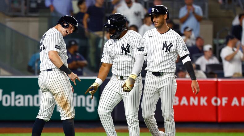 New York Yankees' Ben Rice, left and Heliot Ramos, right , celebrate after Ramos three-run home run during the eighth inning of a baseball game against theColorado Rockies , Tuesday, Sept. 8, 2026, in New York. (AP Photo/Noah K. Murray)