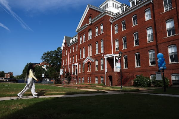 First-year student Alissa Seebaran walks by Giles Hall at Spelman College in Atlanta on Aug. 12, 2026. (Arvin Temkar/AJC)