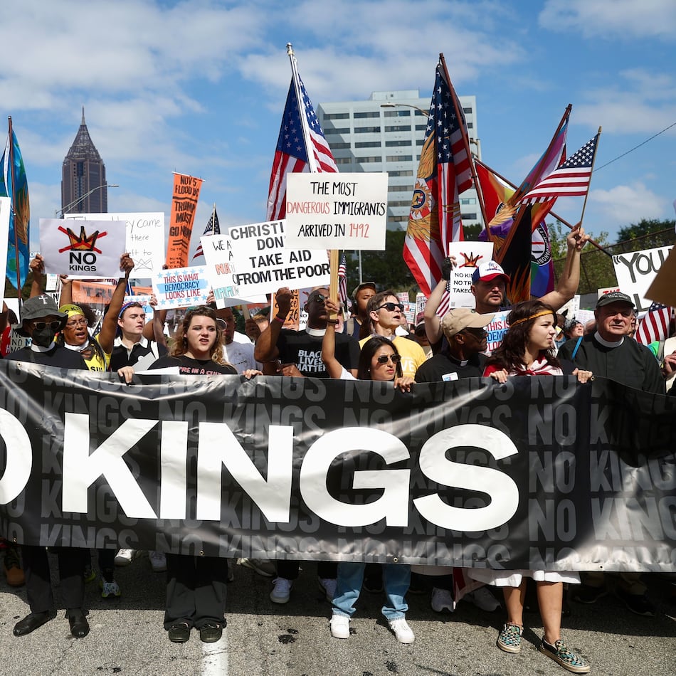 "No Kings" protesters marched down Courtland Street from the Atlanta Civic Center to Liberty Plaza on Saturday. (Abbey Cutrer / AJC)