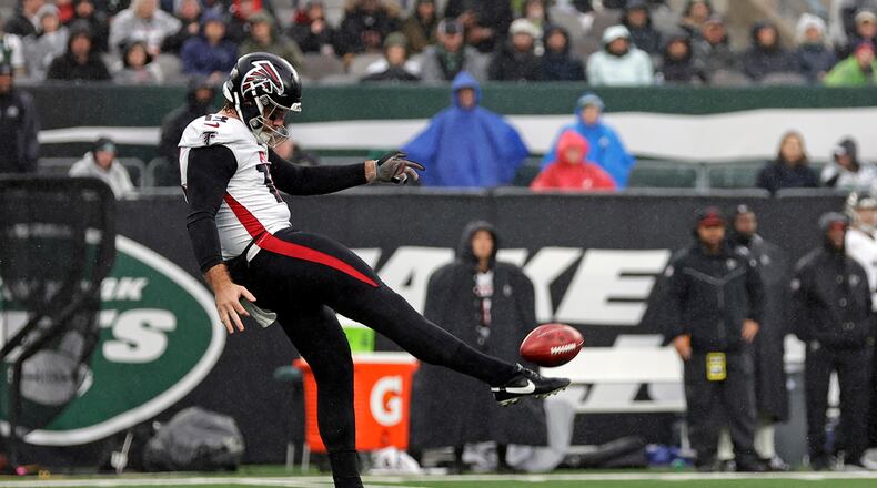 Atlanta Falcons punter Bradley Pinion (13) in action against the New York Jets during an NFL football game Sunday, Dec. 3, 2023, in East Rutherford, N.J. (AP Photo/Adam Hunger)