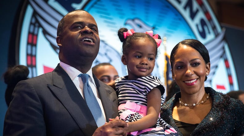 Atlanta Mayor Kasim Reed and his family pose for pictures following the “State of the City Address” at the Atlanta Marriott Marquis, Thursday, Feb. 2, 2017, in Atlanta. BRANDEN CAMP/SPECIAL