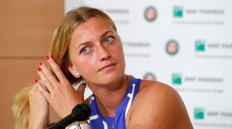 In this May 26, 2017, file photo, Petra Kvitova of the Czech Republic adjusts her hair during a press conference at Roland Garros stadium in Paris. Kvitova will continue her comeback from a knife attack by playing at the Connecticut Open in August, the final WTA tune-up before the U.S. Open. The two-time Wimbledon champion returned to tennis at the French Open, less than six months after suffering a serious injury to her left hand when she was stabbed by an intruder at her home in the Czech Republic. (AP Photo/Christophe Ena, File)