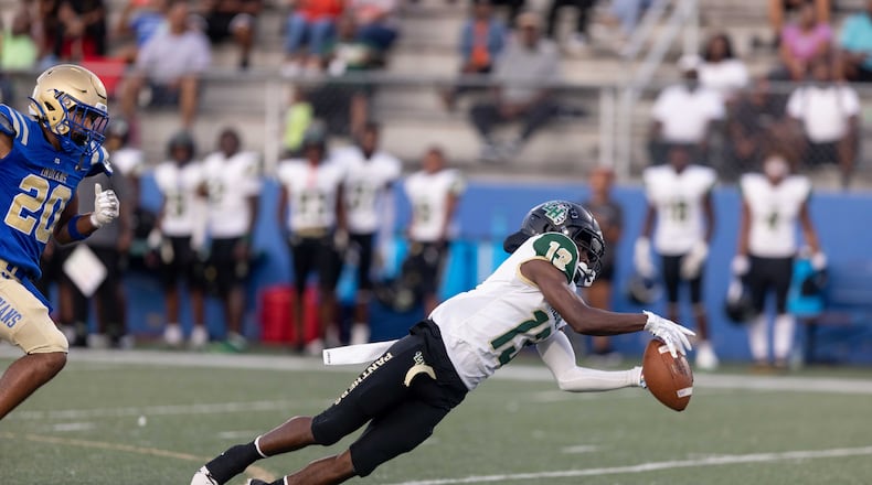 Langston HughesÕs Jovanni McGee (13) reaches for a pass during a GHSA High School football game between Langston Hughes High School and McEachern High School at McEachern High School in Powder Springs, GA., on Friday, August 26, 2022. (Photo by Jenn Finch)