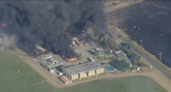 Smoke and flames rise at a fireworks warehouse near Esparto, Calif., on Tuesday, July 1, 2025. (KGO via AP)