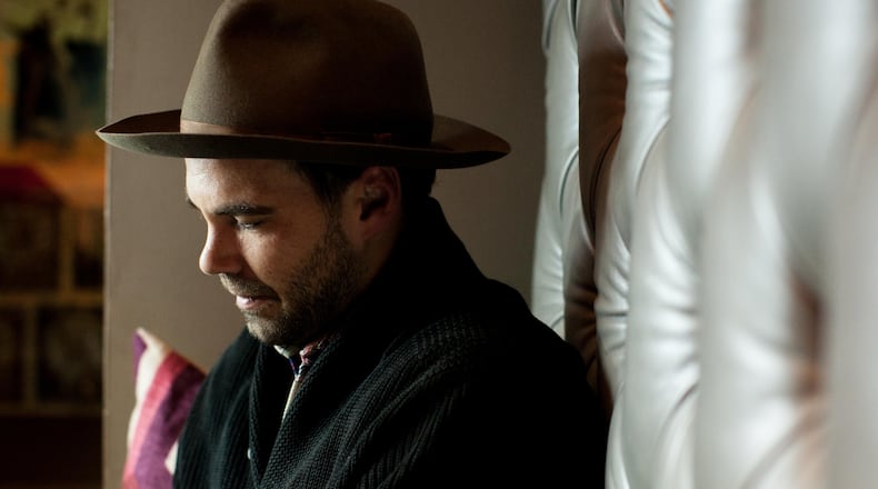 Zach Williams, lead singer of The Lone Bellow, sits during an interview, Saturday, Nov. 8, 2014, in Atlanta. Williams began his music career later in life after his wife was injured in a horse riding accident. (SPECIAL/BRANDEN CAMP)