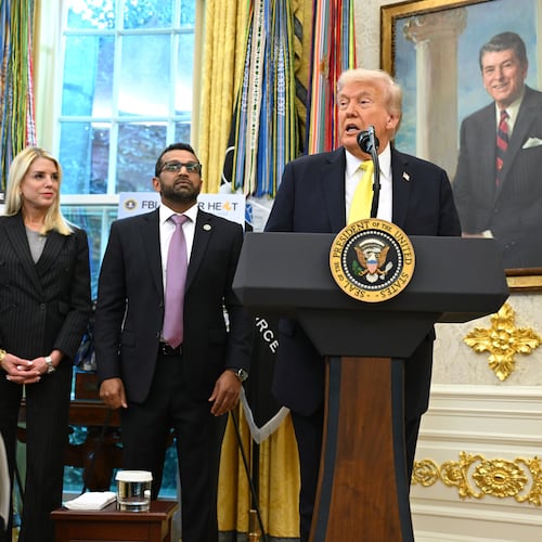 President Donald Trump speaks as FBI Director Kash Patel, Attorney General Pam Bondi, and Deputy Attorney General Todd Blanche listen during an event in the Oval Office at the White House, Wednesday, Oct. 15, 2025, in Washington. (AP Photo/John McDonnell)