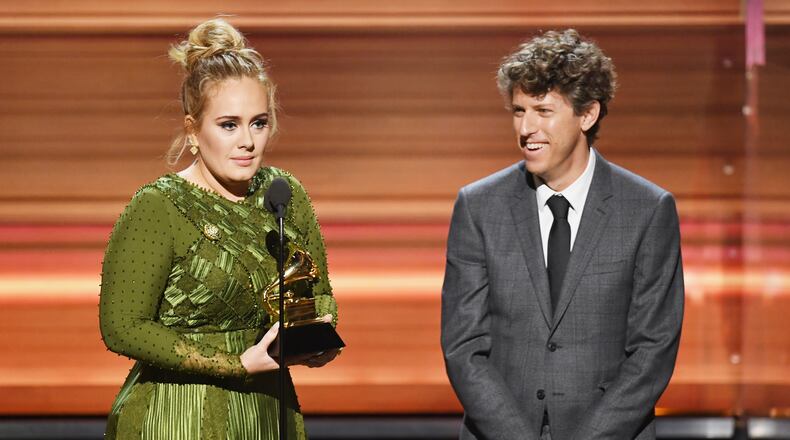Songwriters Adele and Greg Kurstin accept the song of the year award for “Hello” onstage during the 59th annual Grammy Awards on Feb. 12, 2017, in Los Angeles. It was one of Adele’s five Grammy wins this year. KEVIN WINTER/GETTY IMAGES FOR NARAS