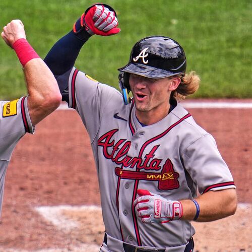 Atlanta Braves' Jim Jarvis, right, celebrates with Mike Yastrzemski (18) as he returns to the dugout after hitting a two-run home run off Pittsburgh Pirates pitcher Cam Sanders during the fourth inning of a baseball game in Pittsburgh, Thursday, July 9, 2026. (AP Photo/Gene J. Puskar)
