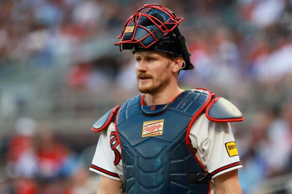 Braves catcher Sean Murphy speaks with an umpire during a break against the New York Mets at Truist Park on Monday, Aug. 10, 2026, in Atlanta. (Jason Getz/AJC)