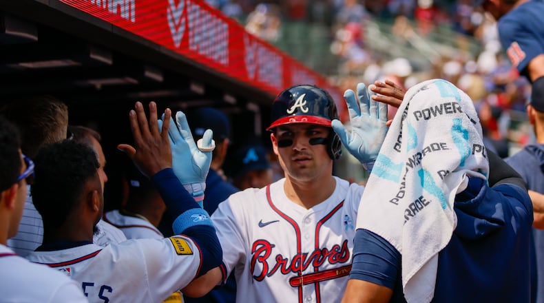 Atlanta Braves third baseman Austin Riley (27) is congratulated at the dugout after hitting a two-run home run at the bottom of the eighth inning against the Tampa Bay Rays at Truist Park on Sunday, June 16, 2024, in Atlanta.
(Miguel Martinez/ AJC)