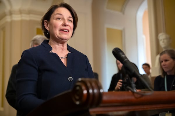 FILE - Sen. Amy Klobuchar, D-Minn., speaks with reporters on Capitol Hill, Dec. 3, 2024, in Washington. (AP Photo/Mark Schiefelbein, File)