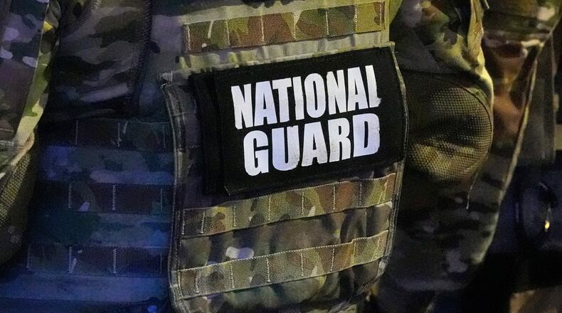 FILE - A member of the National Guard stands watch on Beale St., July 17, 2026, in Memphis, Tenn. (AP Photo/George Walker IV, File)