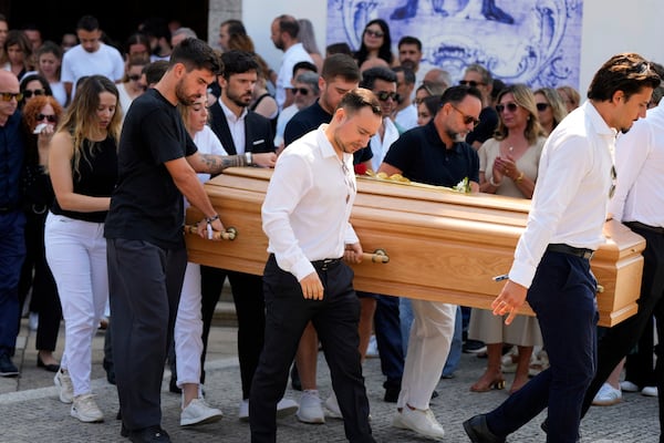 Diogo Jota's wife Rute Cardoso reacts next to the coffin of his husband, during his funeral in Gondomar, near Porto, Portugal, on Saturday, July 5, 2025. (AP Photo/Manu Fernandez)