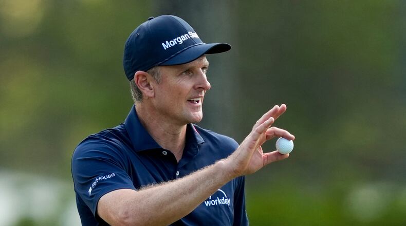 Justin Rose, of England, waves after his putt on the eighth hole during the final round of the Masters golf tournament at the Augusta National Golf Club, Sunday, April 12, 2026, in Augusta, Ga. (AP Photo/Matt Slocum)