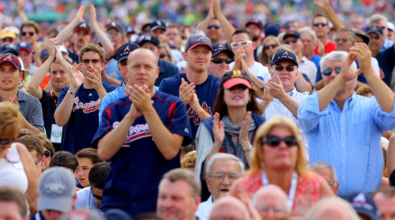 Braves fans cheer on during induction ceremonies at the Hall of Fame in Cooperstown, N.Y.