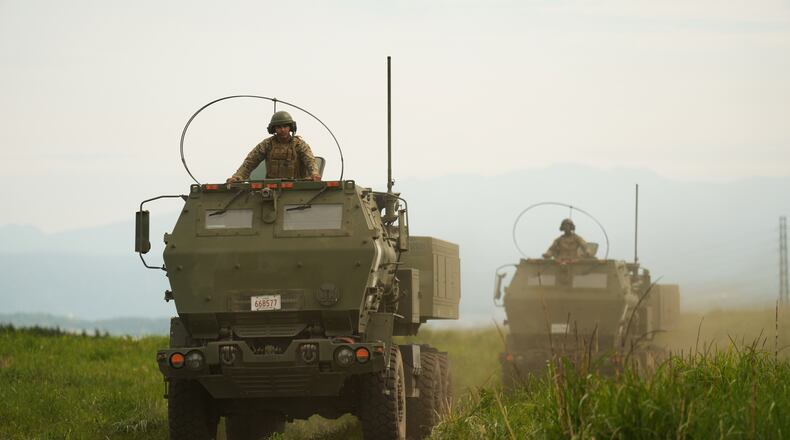 U.S. Marines appear to show the High Mobility Artillery Rocket System (HIMARS) mounted on trucks during a media tour after they conducted its live-fire training at Camp Fuji, in Gotemba, southwest of Tokyo, Wednesday, May 20, 2026. (AP Photo/Hiro Komae)
