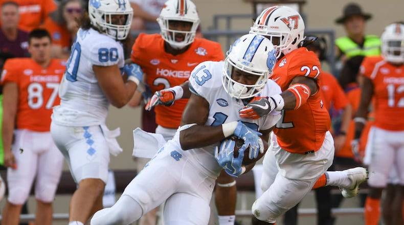 BLACKSBURG, VA - OCTOBER 21: Wide receiver Josh Cabrera #13 of the North Carolina Tar Heels makes a reception while being defended by safety Terrell Edmunds #22 of the Virginia Tech Hokies in the first half at Lane Stadium on October 21, 2017 in Blacksburg, Virginia. (Photo by Michael Shroyer/Getty Images)