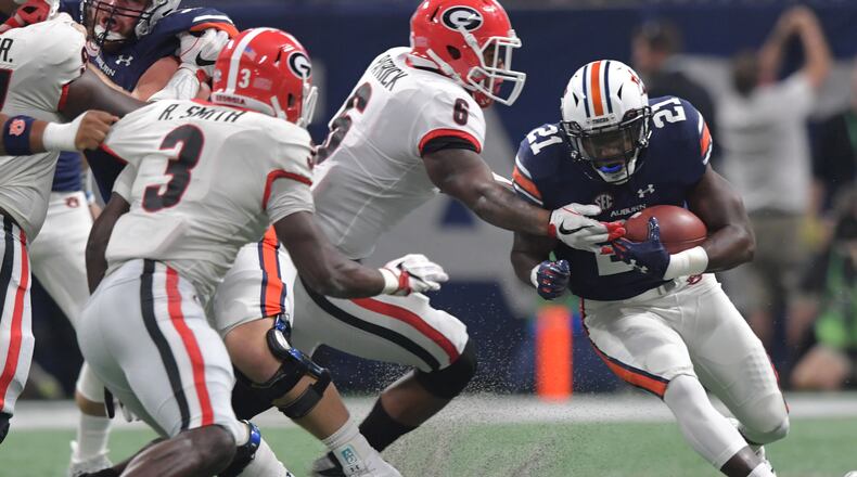 Georgia linebacker Natrez Patrick (6) defends against Auburn running back Kerryon Johnson in the SEC championship game two weeks ago.