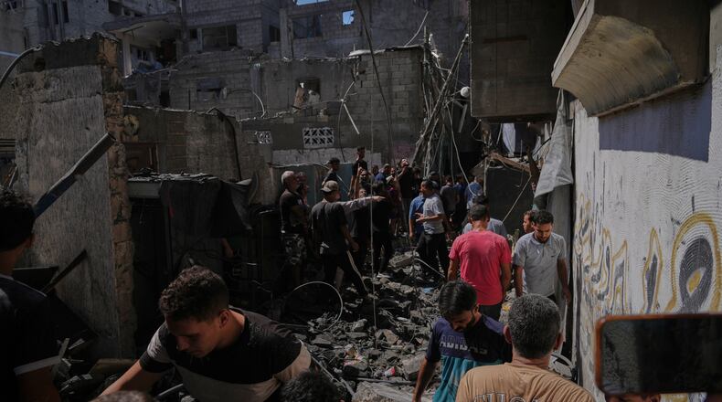 Palestinians inspect a building destroyed in an Israeli airstrike in Gaza City, Wednesday, Sept. 9, 2026. (AP Photo/Jehad Alshrafi)