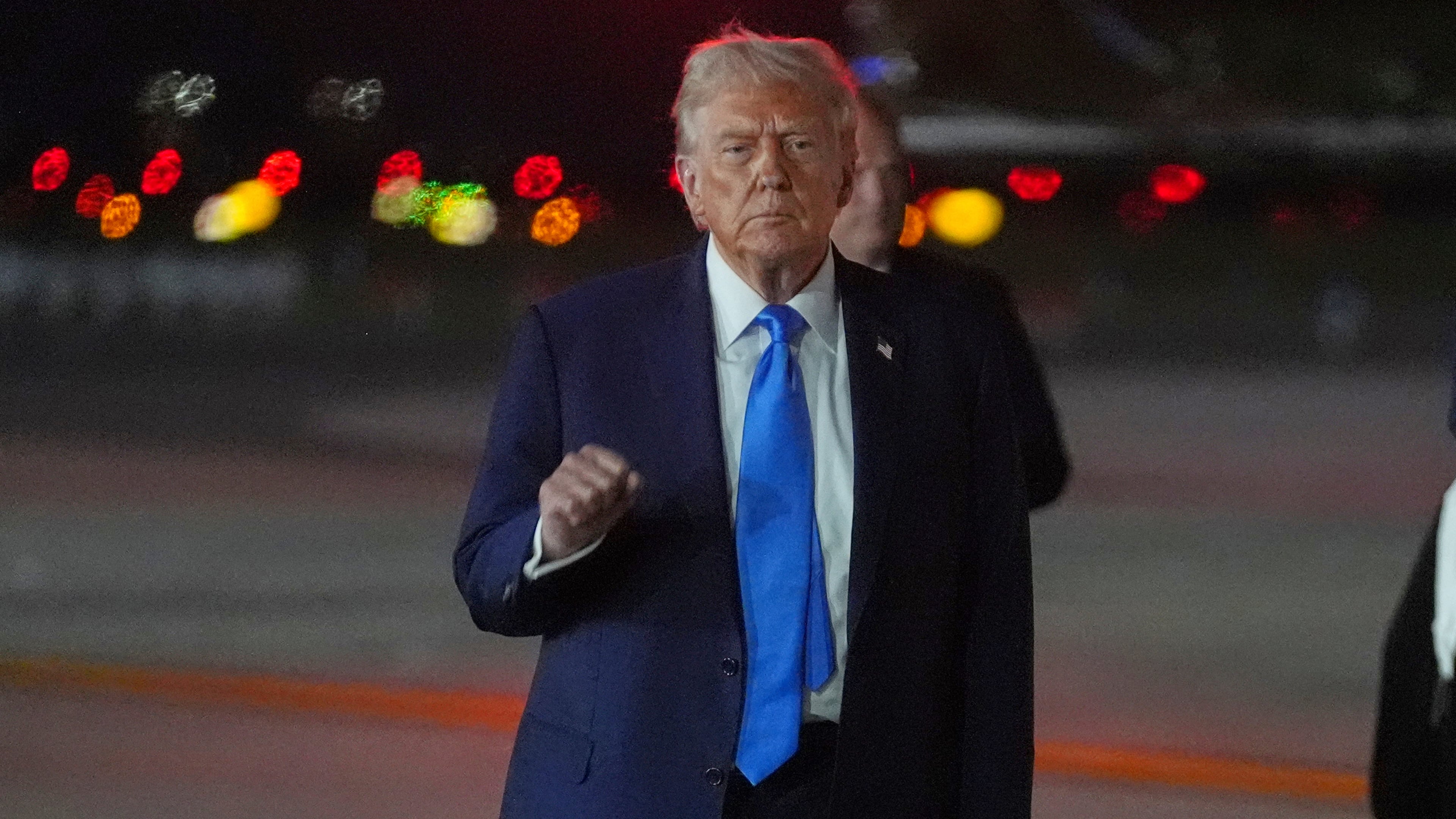 President Donald Trump gestures as he arrives on Air Force One at John F. Kennedy International Airport, Monday, Sept. 22, 2025, in New York. (AP Photo/Evan Vucci)