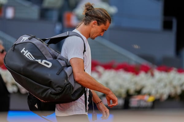 Alexander Zverev of Germany leaves the court after losing to Juan Manuel Cerundolo of Argentina during the Madrid Open tennis tournament in Madrid, Spain, Tuesday, April 29, 2025. (AP Photo/Manu Fernandez)