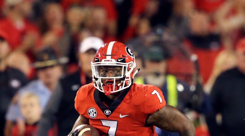 Georgia running back D'Andre Swift (7) run against Kentucky in the second half of an NCAA college football game Saturday, Nov. 18, 2017, in Athens, Ga. (AP Photo/John Bazemore)